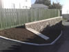 Mortar bedded Stone wall WITH BRICK COPING.